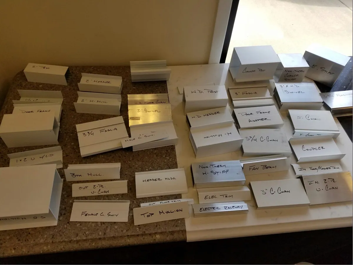 Laser-labelled sunroom components laid out before assembly