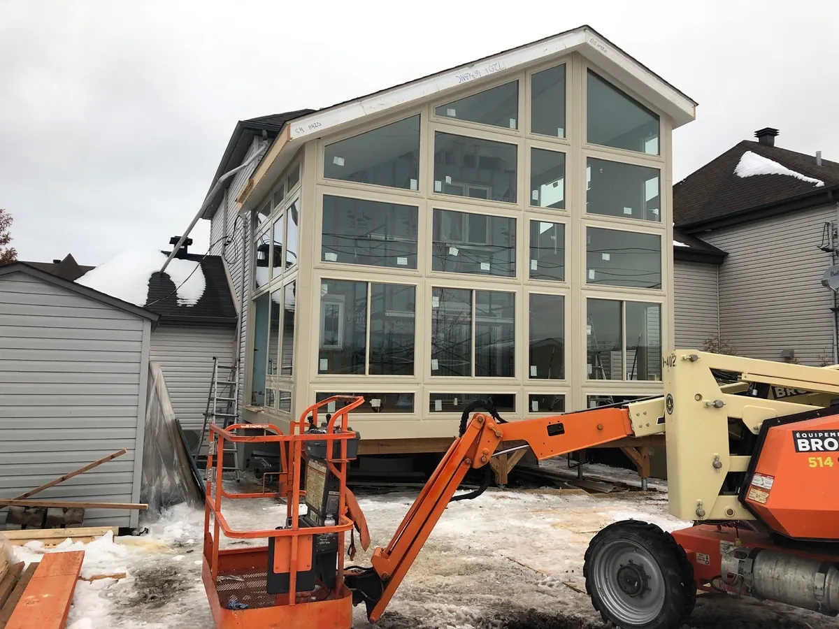 Two-storey gable glazing installed with a boom lift