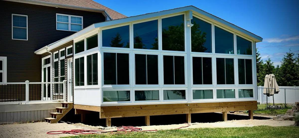 White gable sunroom on a new timber deck