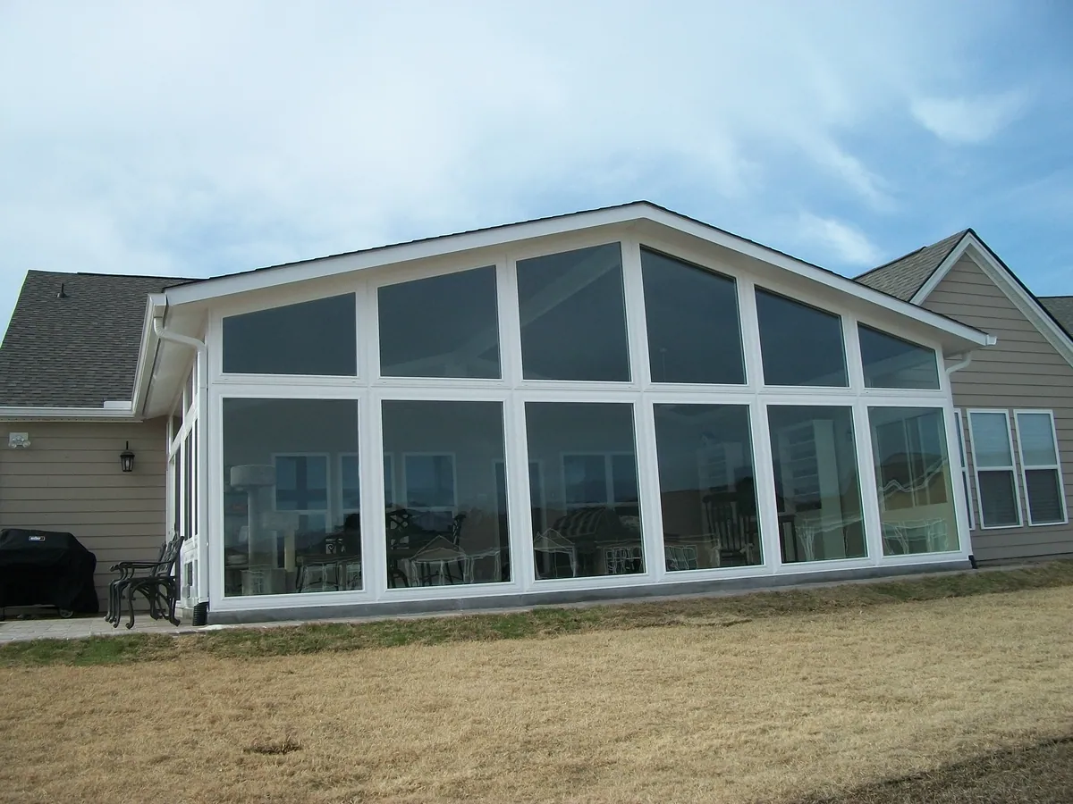 Wide gable sunroom with a full wall of glass