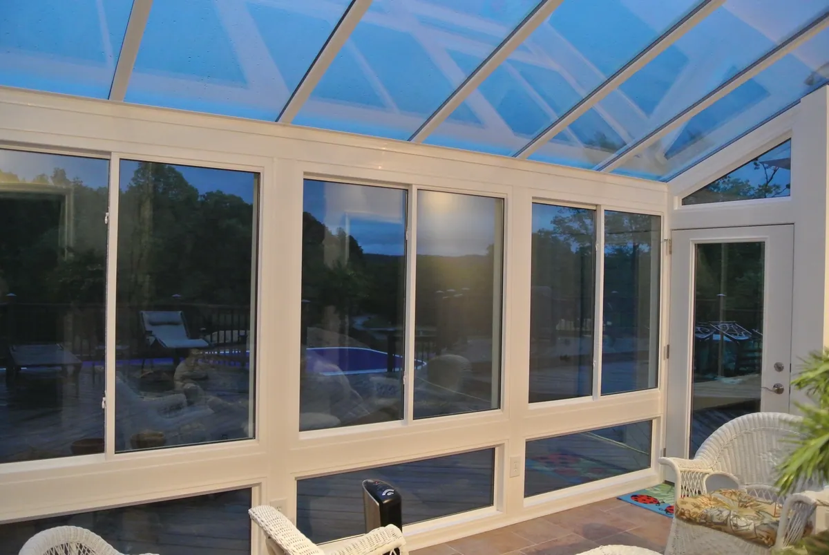 Glass-roof sunroom with panoramic windows on three sides