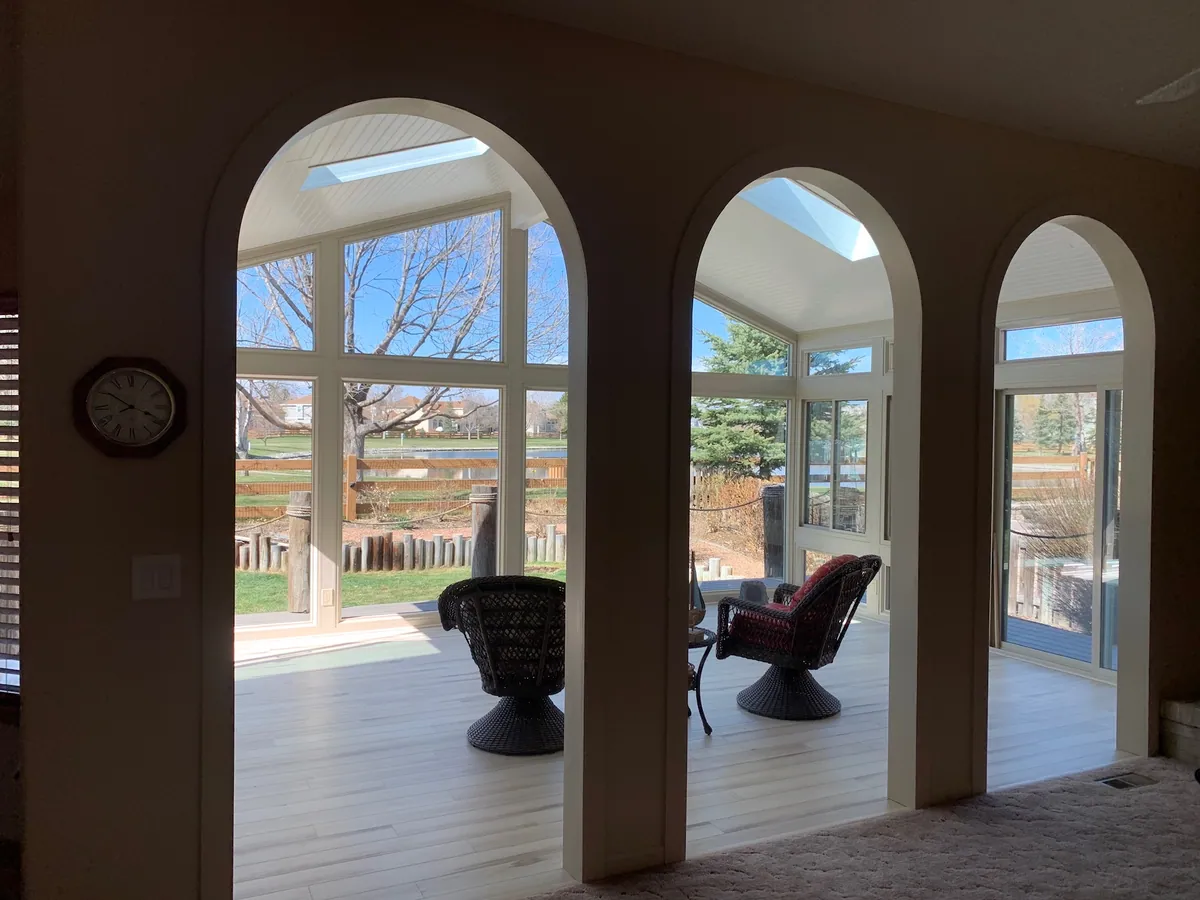 Sunroom with arched windows and a clerestory
