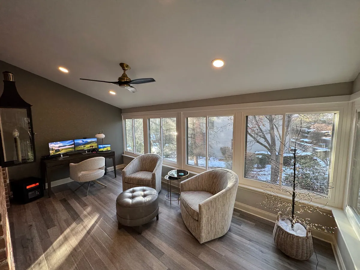Sunroom with a fireplace and swivel chairs