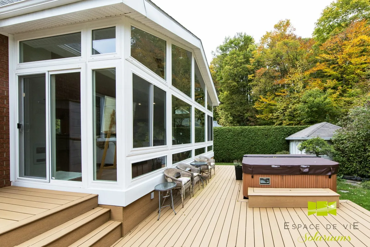 Covered patio beside a sunroom