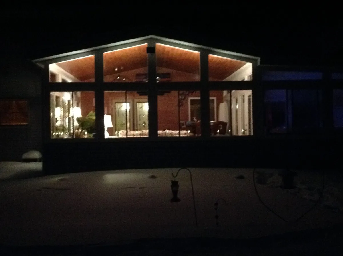 Sunroom glowing at dusk