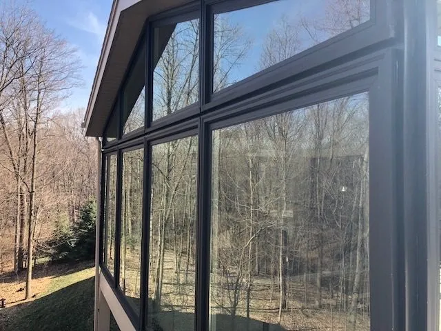 Sunroom looking out over a snowy garden