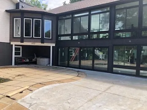 Dark-frame modern sunroom